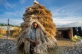 Bangladesh Ã¢â¬â July 25, 2020: A woman from the village is carrying wet jute on her shoulder to dry at flood-affected areas